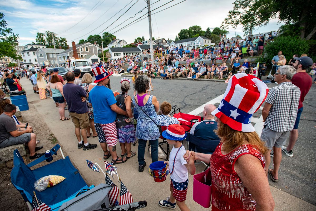 People line the sidewalks during the Fireman's Parade in Rockport, Massachusetts on Independence Day, July 4, 2022. - This is the first time the the annual parade and July 4th festivities have been held since 2019. (Photo by Joseph Prezioso / AFP)