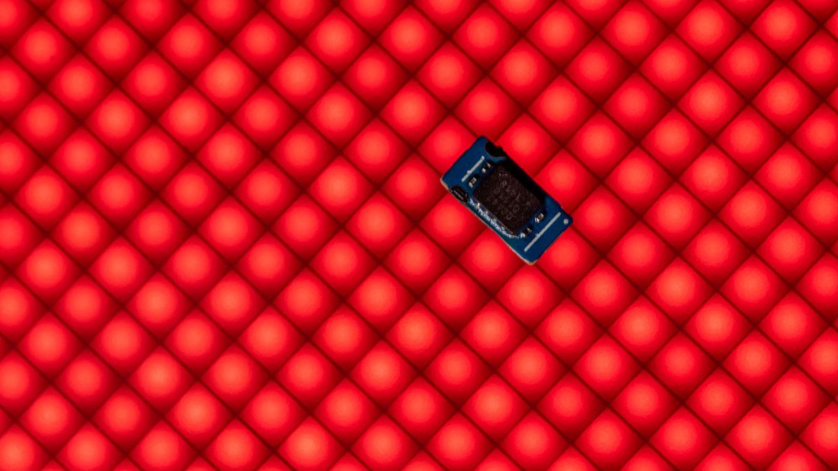 ILLUSTRATION - 25 February 2022, North Rhine-Westphalia, Bad Oeynhausen: A chip from a smartphone lies on an LED wall. The global chip shortage has slowed down the world economy. Photo: Lino Mirgeler/dpa (Photo by Lino Mirgeler / DPA / dpa Picture-Alliance via AFP)