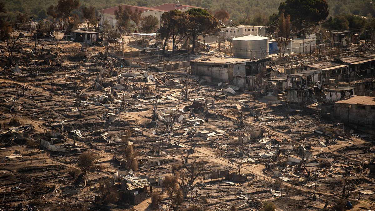 A picture taken on September 16, 2020, shows the remains of the burnt Moria migrant camp on the Greek Aegean island of Lesbos, after it was destroyed by a major fire on the night of September 8. - Six young Afghan men including two minors will face a prosecutor on Greece's Lesbos island on September 16 on suspicion of setting fires that destroyed Europe's largest migrant camp, leaving over 12,000 people homeless. (Photo by ANGELOS TZORTZINIS / AFP)