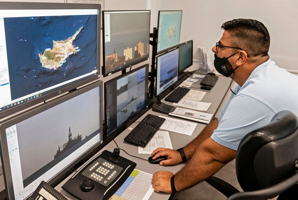 A picture shows operators working at the Joint Rescue Coordination Center during the multinational exercise "NEMESIS 2021", on November 3, 2021 in the Cypriot coastal city of Larnaca. - Multinational, multiagency large-scale exercise Nemesis 2021 involving assets from eight countries is taking place in Cyprusí Exclusive Economic Zone for the eighth consecutive year. The purpose of the exercise is to prepare all services involved in the implementation of Cyprusí energy programme to be ready to tackle any emergency on a rig. (Photo by Iakovos Hatzistavrou / AFP)