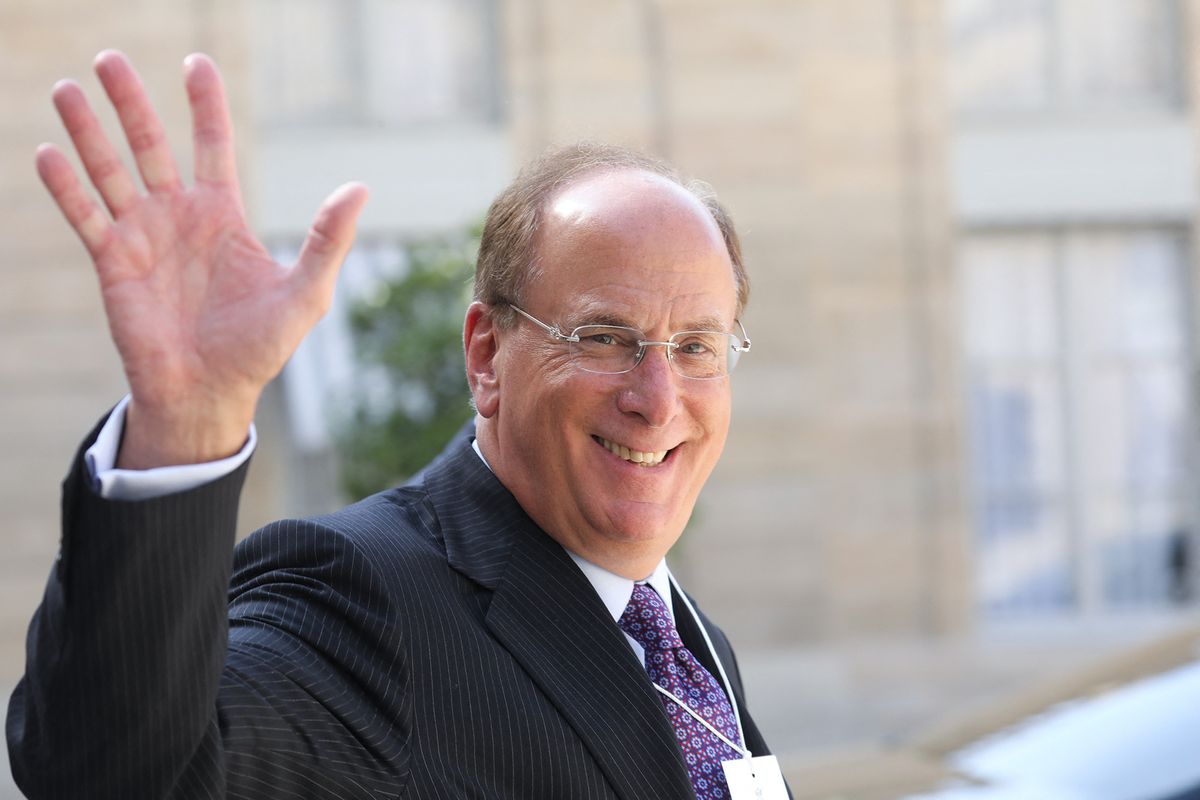 Chairman and CEO of BlackRock, Larry Fink (L) waves as he leaves a meeting about climate action investments with heads of sovereign wealth funds and French President at the Elysee Palace in Paris on July 10, 2019. (Photo by Ludovic MARIN / AFP)