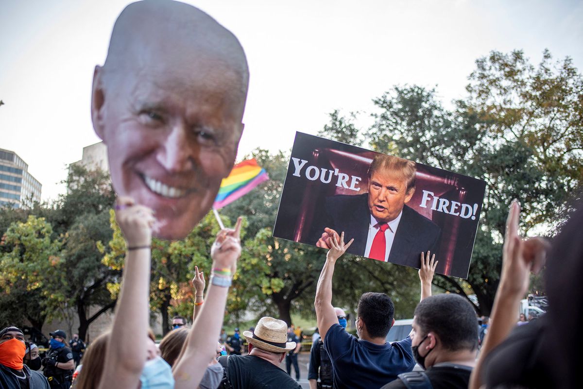 Supporters of US President-elect Joe Biden gather near the Texas capitol building to celebrate his victory in the 2020 presidential election in Austin, Texas on November 7, 2020. - Democrat Joe Biden has won the White House, US media said November 7, defeating Donald Trump and ending a presidency that convulsed American politics, shocked the world and left the United States more divided than at any time in decades. (Photo by Sergio FLORES / AFP)