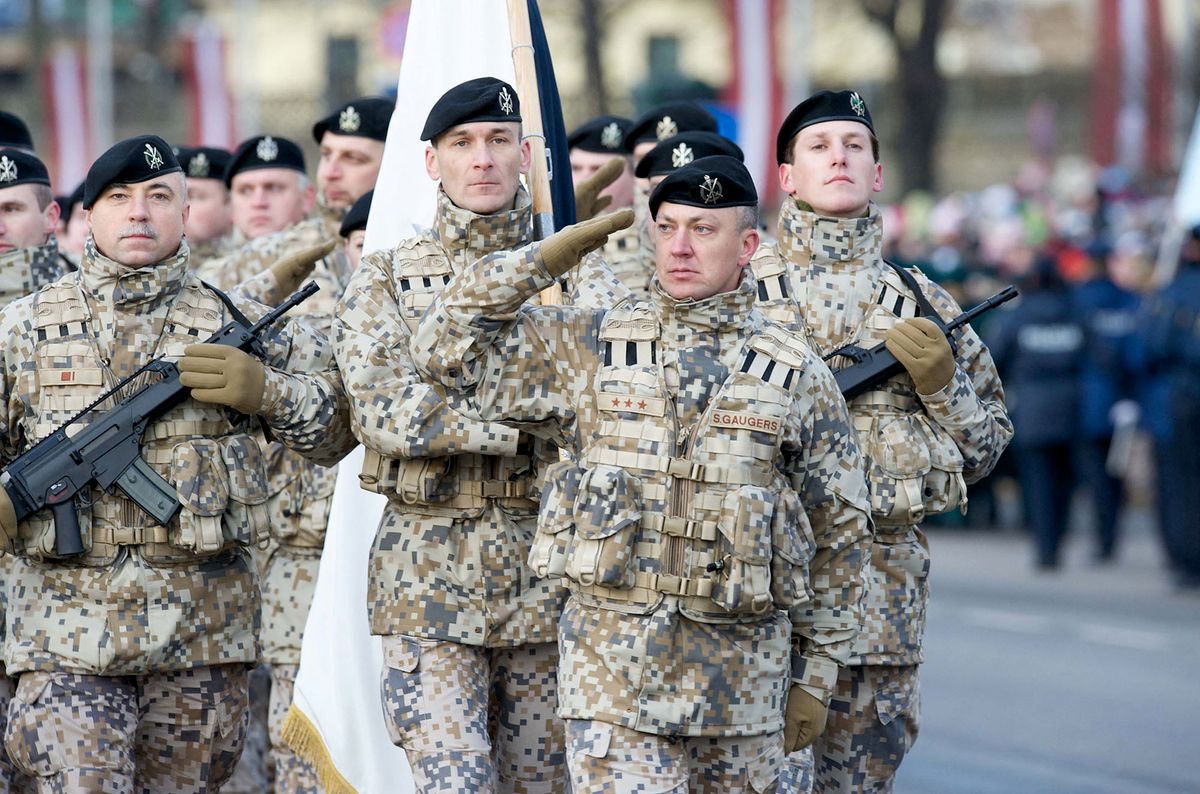 Latvian soldiers march during a military parade on November 18, 2008 to celebrate Latvia's 90th anniversary of independence from Russia, an era of freedom that was snuffed out by the Soviet Union after World War II and only restored in 1991. Nationalism rose in Latvia towards the end of the 19th century, culminating in a declaration of independence on November 18, 1918, after World War I and two revolutions in Russia had brought down the Tsarist empire. Latvia joined the European Union and NATO in 2004.  AFP PHOTO/ILMARS ZNOTINS (Photo by ILMARS ZNOTINS / AFP)