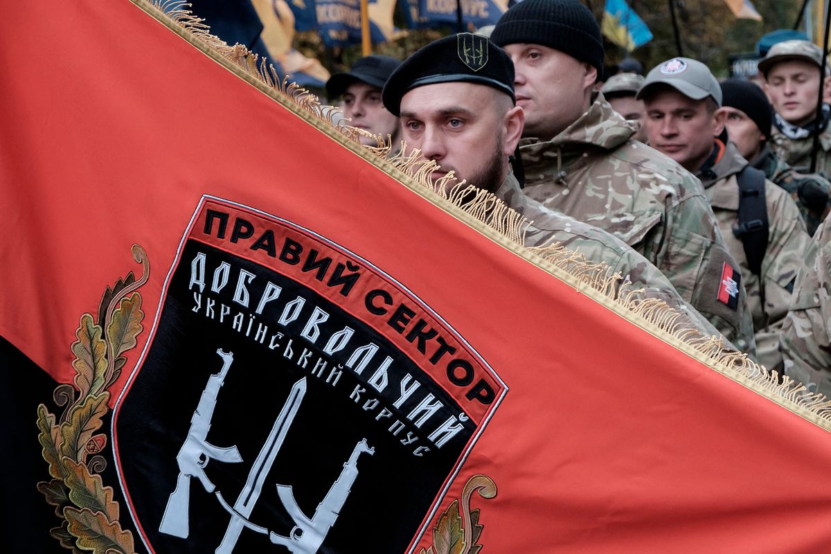 Activists and supporters of the Azov civil corp, Svoboda (Freedom), Ukrainian nationalist parties and the far-right radical group Right Sector take part in a rally to mark Defender of Ukraine Day, in Kyiv, Ukraine October 14, 2017 (Photo by Maxym Marusenko/NurPhoto) (Photo by Maxym Marusenko / NurPhoto / NurPhoto via AFP)