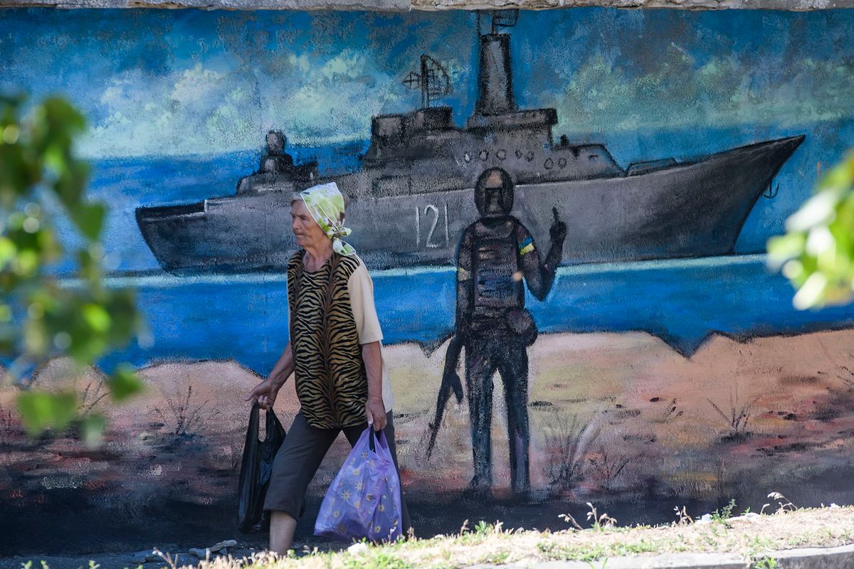 Mural with the iconic ukrainian postage stamp of a Ukrainian soldier gesturing towards a Russian warship off Snake Island is seen on the wall in Kyiv, Ukraine, July 01, 2022 (Photo by Maxym Marusenko/NurPhoto) (Photo by Maxym Marusenko / NurPhoto / NurPhoto via AFP)