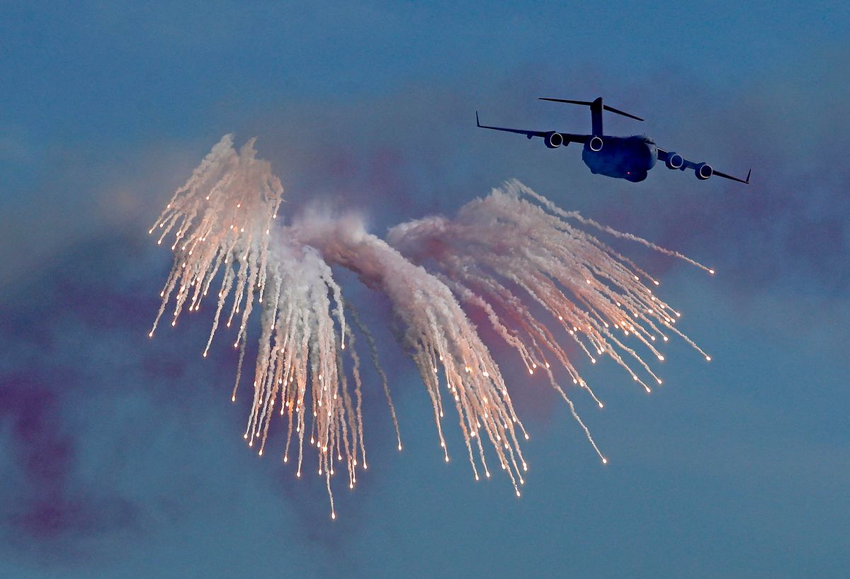 A Boeing C-17 military transport aircraft of the Qatar Air Force performs during a military parade to mark Qatar's national day celebration, in the capital Doha on December 18, 2020. (Photo by AFP)