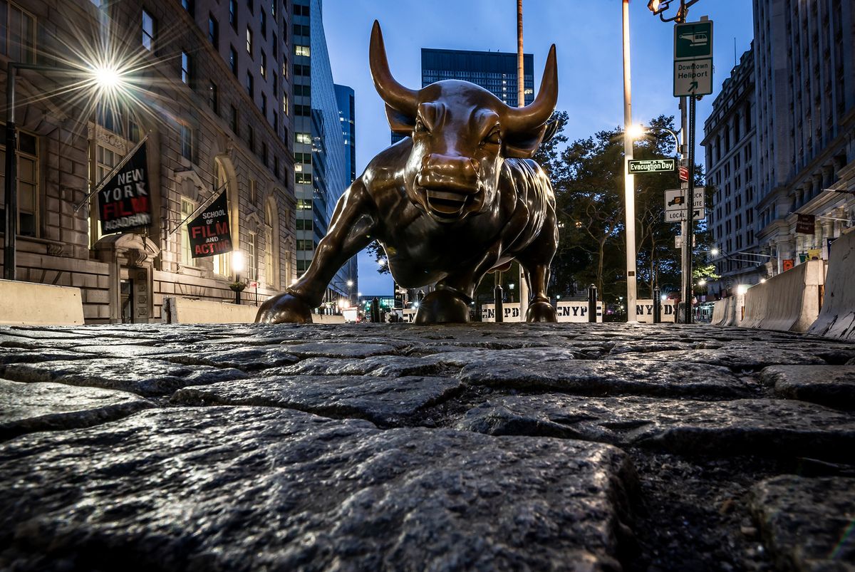 New,York,City,,Usa,-,October,11,,2018:,A,View, NEW YORK CITY, USA - OCTOBER 11, 2018: A view of the Charging Bull statue at dawn, located in lower Manhattan on Wall Street
