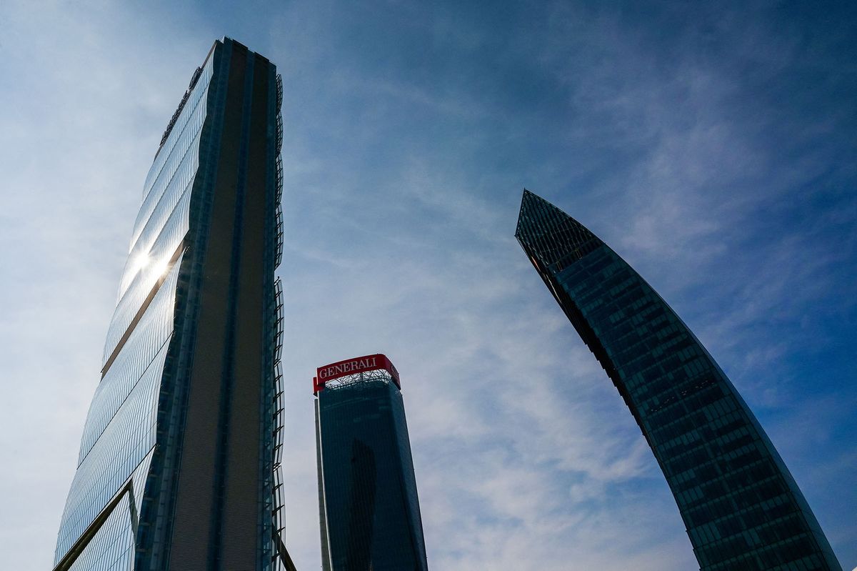 A picture taken on March 12, 2021 shows (From L) the Isozaki Tower or Allianz Tower, the Generali Tower (L) and the Libeskind Tower (Il Curvo), also known as the PwC Tower, in the City Life business district of Milan. - The Libeskind Tower, which houses PricewaterhouseCoopers, a multinational professional services network of firms, operating as partnerships under the PwC brand, is situated between towers designed by Zaha Hadid Architects and Arata Isozaki & Associates who won the competition in conjuction with Studio Libeskind in 2004. (Photo by MIGUEL MEDINA / AFP)