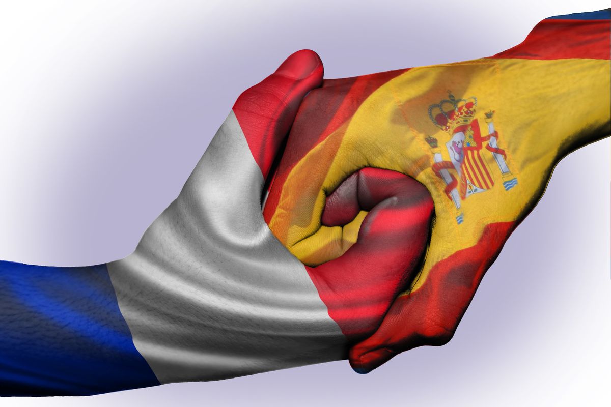 Diplomatic,Handshake,Between,Countries:,Flags,Of,France,And,Spain,Overprinted