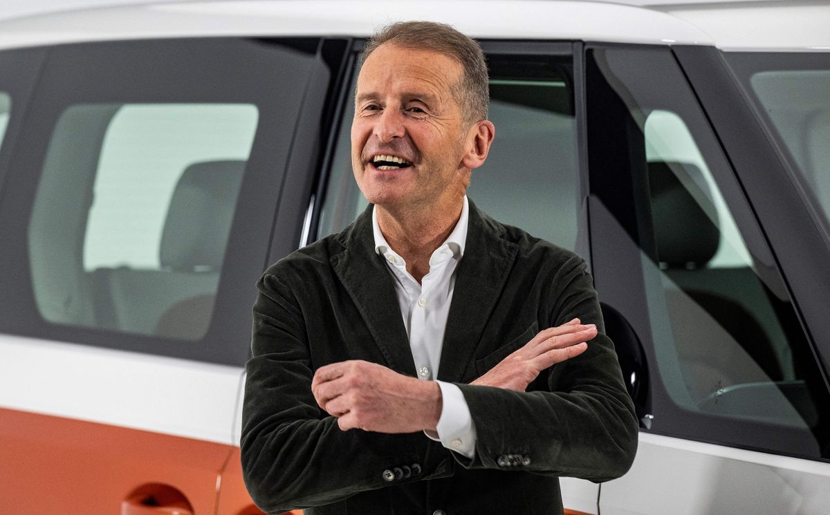 Volkswagen Group Chief Executive Officer (CEO) Herbert Diess poses in front of the new Volkswagen ID Buzz electric van, during an unveiling event on March 9, 2022 in Hamburg, northern Germany. - The German automaker unveiled the camper's latest iteration, known as the ID.Buzz, part of the flagship ID line with which Volkswagen is leading a multi-billion-euro charge into the electric car market. 