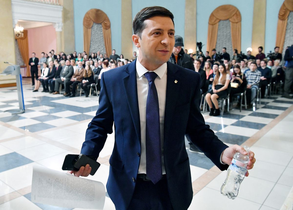 Ukrainian comic actor, showman and presidential candidate Volodymyr Zelensky gestures prior to the shooting of the television series "Servant of the People" where he plays the role of the President of Ukraine, in Kiev on March 6, 2019. - Anger with the political elite is partly behind the rise of Volodymyr Zelensky, a TV actor with no political experience who is the frontrunner in the upcoming presidential vote.  Zelensky is polling at 25 percent, ahead of Poroshenko on 17 percent and former prime minister Yulia Tymoshenko on 16 percent as of March 4, 2019.