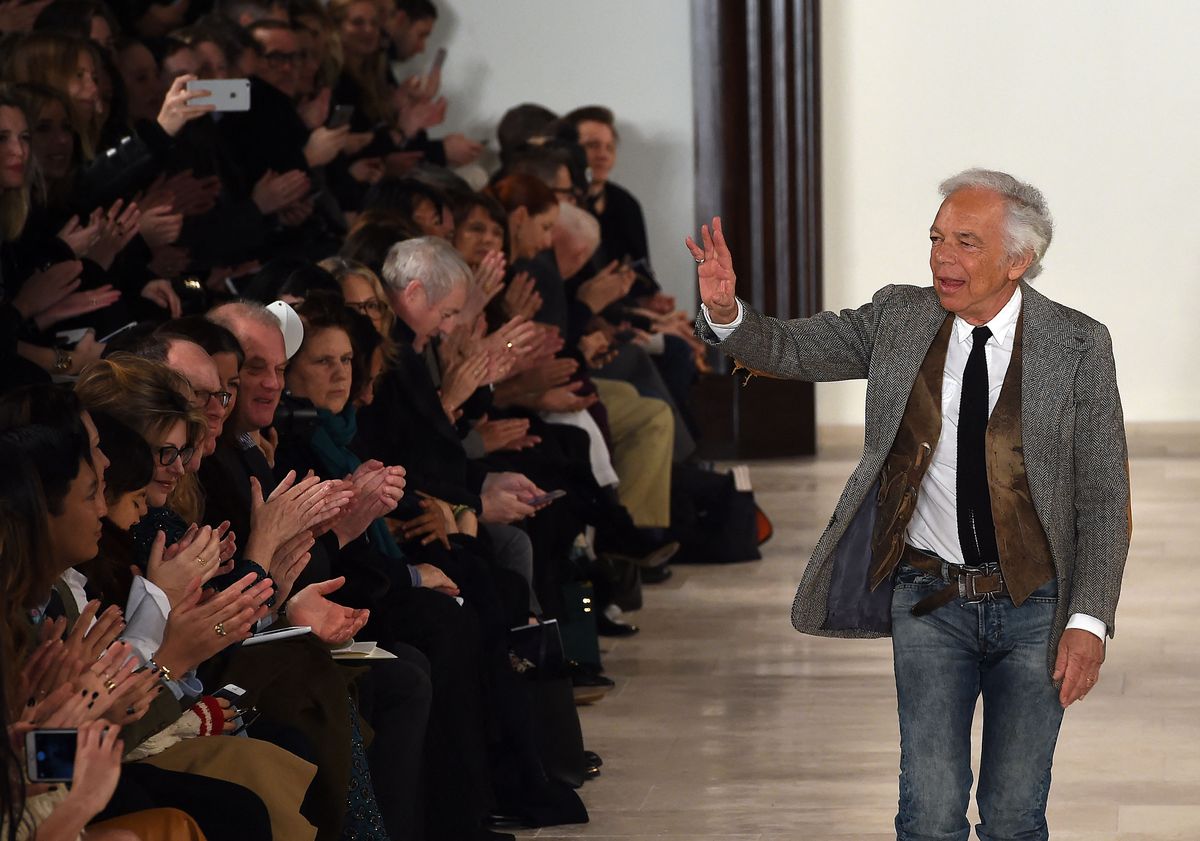 Designer Ralph Lauren greets the audience after presenting his creations during the Fall 2016 New York Fashion Week on February 18, 2016, in New York. (Photo by Jewel Samad / AFP)
