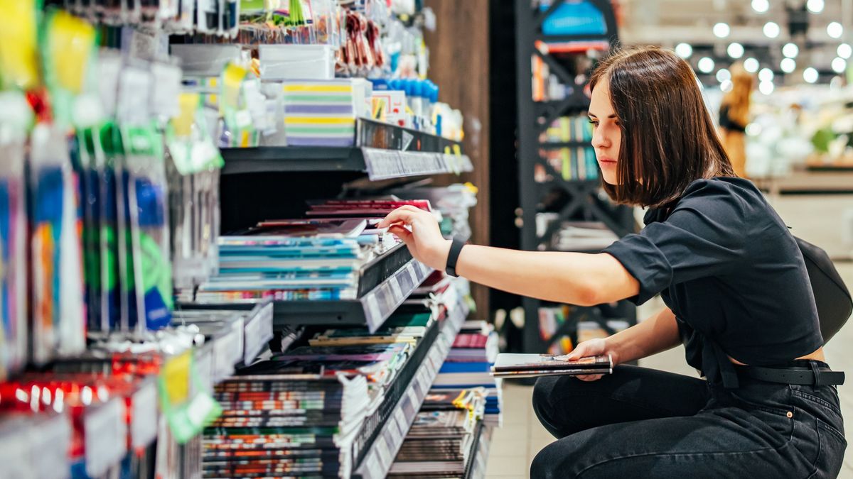 Portrait,Of,Young,Woman,Choosing,School,Stationery,In,Supermarket.