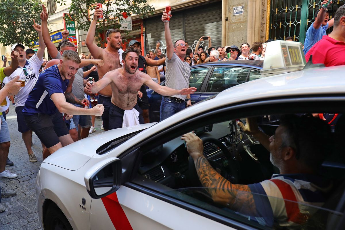 Tottenham supporters hold up a taxi in the streets of Madrid, ahead of the Champions League final of Liverpool v Tottenham Hotspur at the Wanda Metropolitan Stadium in the Spanish capital on Saturday night. (Photo by Aaron Chown/PA Images via Getty Images)1147214561