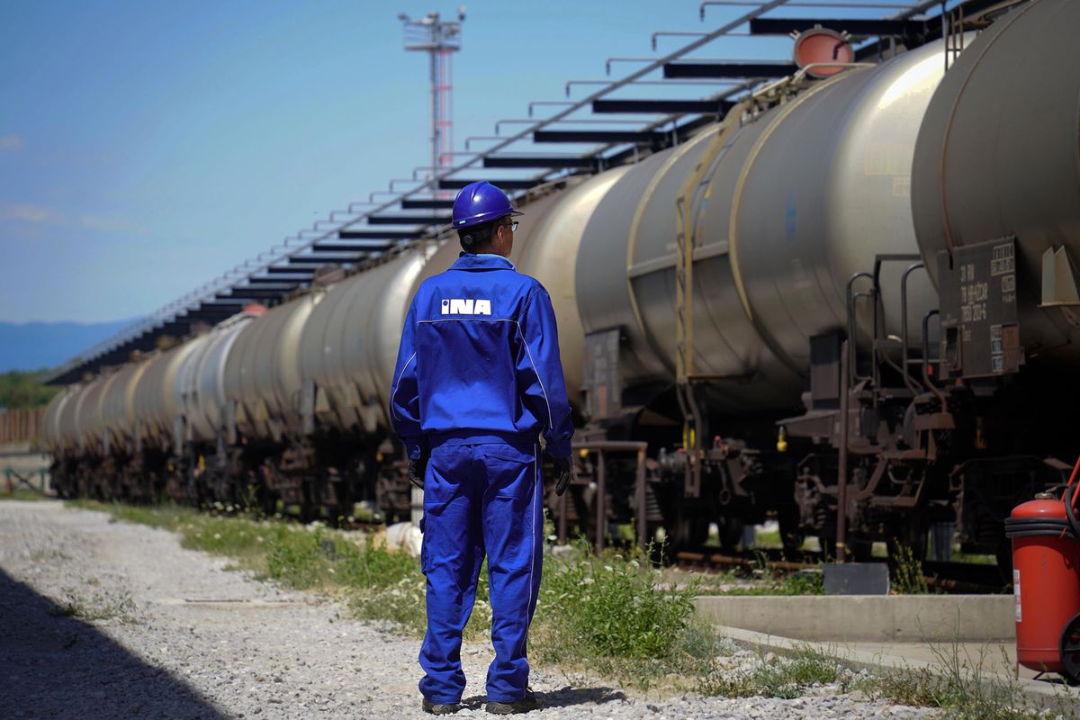 1242009500 Freight wagons in the rail yard at the INA Industrija Nafte d.d. oil refinery in Urinj, Croatia, on Monday, July 18, 2022. The European Union last week gave its final approval for Croatia to join the euro zone early next year as the region looks to strike a delicate balance between bringing down inflation and sustaining output as the region risks a total cut off of Russian gas. Photographer: Oliver Bunic/Bloomberg via Getty Images