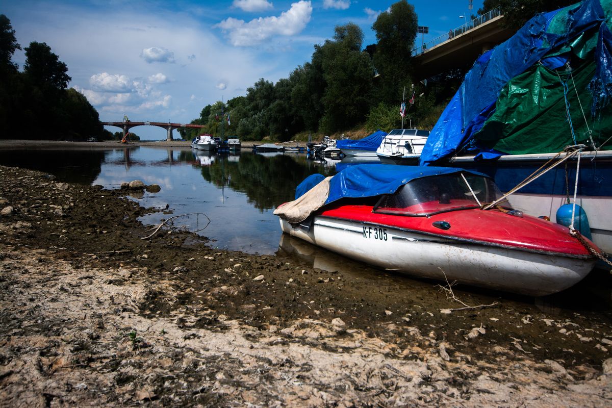 a boat is seen resting on  on partically dried up river bank of ohbach rivver which direct connect to Rhine river during the low water level of Rhine river in Bad Honnef, Germany on August 16, 2022 
