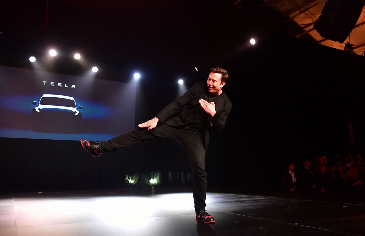 Tesla CEO Elon Musk gestures during the unveiling of the new Tesla Model Y in Hawthorne, California on March 14, 2019. - Tesla introduced a new electric sports utility vehicle slightly bigger and more expensive than its Model 3, pitched as an electric car for the masses. Tesla chief executive Elon Musk showed off the "Model Y" late Thursday, March 14, 2019, at the company's design studio in the southern California city of Hawthorne, and the company began taking orders online. (Photo by Frederic J. BROWN / AFP)