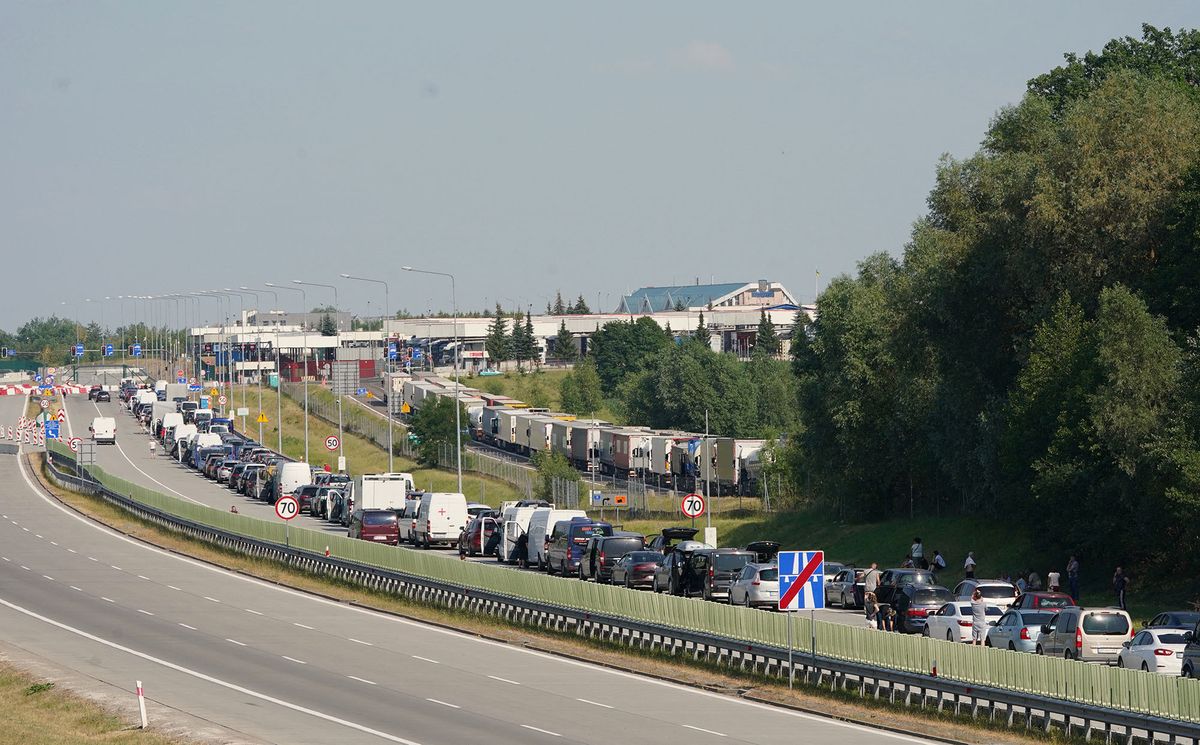 Huge queues of cars are seen near the Polish-Ukrainian border near Korczowa on June 30, 2022 due to the return of the import tax on vehicles in Ukraine from 1 July, 2022. - As temperatures in southern Poland reached nearly 40 degrees Celsius, thousands of Ukrainians spend days waiting on the motorway to bring cars bought in the EU to Ukraine and benefit from tax exemption valid until July 1, 2022. (Photo by JANEK SKARZYNSKI / AFP)