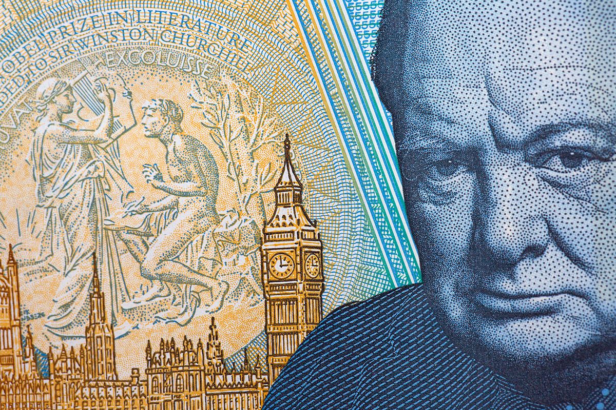 628297836 Close up of the new water proof polymer five pound note, showing the head of Sir Winston Churchill on the reverse side.
