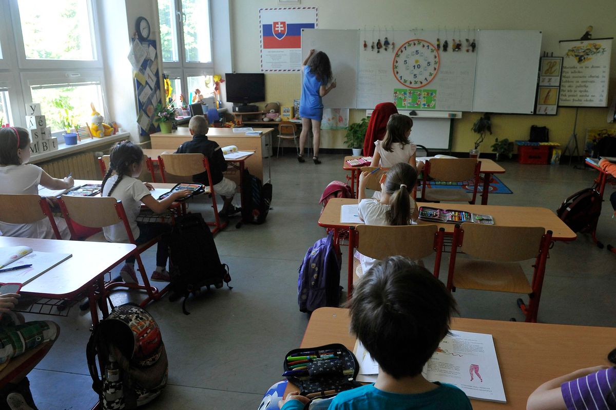 Children sit in a classroom to learn at school in Bratislava on June 10, 2013.   AFP PHOTO / SAMUEL KUBANI (Photo by SAMUEL KUBANI / AFP)
