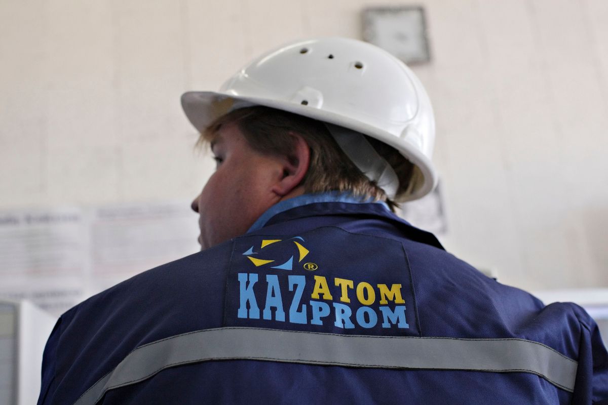 A Kazatomprom employee works at a computer monitoring statio