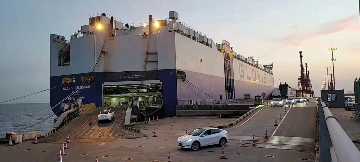 (220529) -- CHANGCHUN, May 29, 2022 (Xinhua) -- A ship is loaded with electric cars produced by U.S. automaker Tesla's Shanghai Gigafactory at a port in east China's Shanghai, May 11, 2022. (Xinhua) 