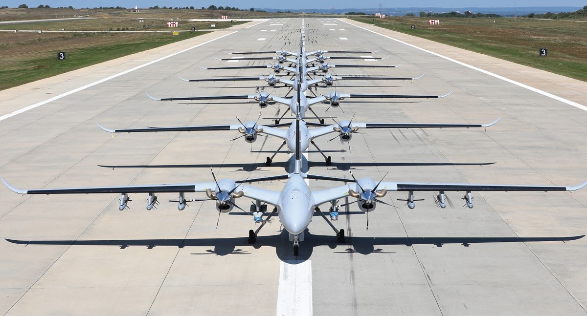 ISTANBUL, TURKEY - JULY 05: (----EDITORIAL USE ONLY - REQUIRED CREDIT - "BAYKAR / PUBLISHER" - NO MARKETING NO ADVERTISING CAMPAIGNS - DELIVERED AS A SERVICE TO CUSTOMERS ----) 7 Bayraktar Akinci Unmanned Aerial Vehicles (UAV) assembled into a fleet on July 05, 2022 at the Aviation Training and Test Center in Istanbul, Turkiye.  3 of the UAVs used for training and testing at the Corlu Airfield Base Command, and 4 of the UAVs to be delivered to the Air Force Command took part in the photography and videography.  BAYKAR/Handout / Anadolu Agency (