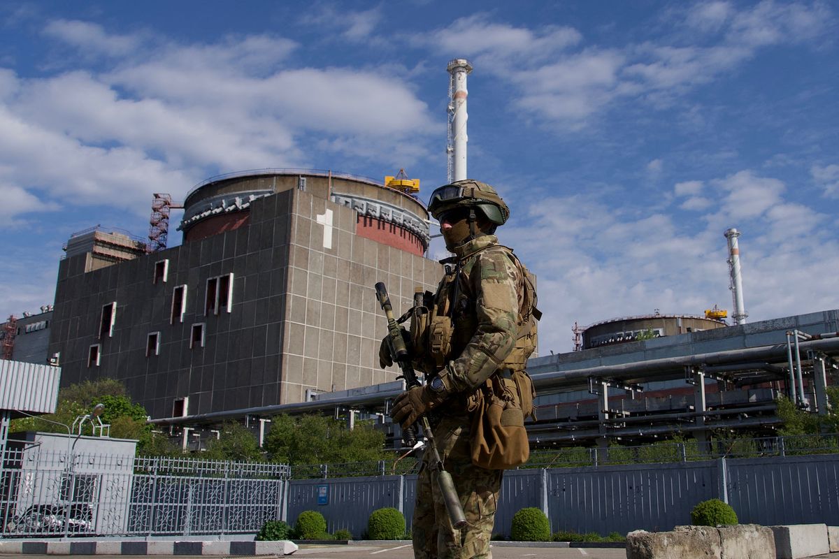 A Russian serviceman patrols the territory of the Zaporizhzhia Nuclear Power Station in Energodar on May 1, 2022. - The Zaporizhzhia Nuclear Power Station in southeastern Ukraine is the largest nuclear power plant in Europe and among the 10 largest in the world.  *EDITOR'S NOTE: This picture was taken during a media trip organised by the Russian army.* (Photo by Andrey BORODULIN / AFP)