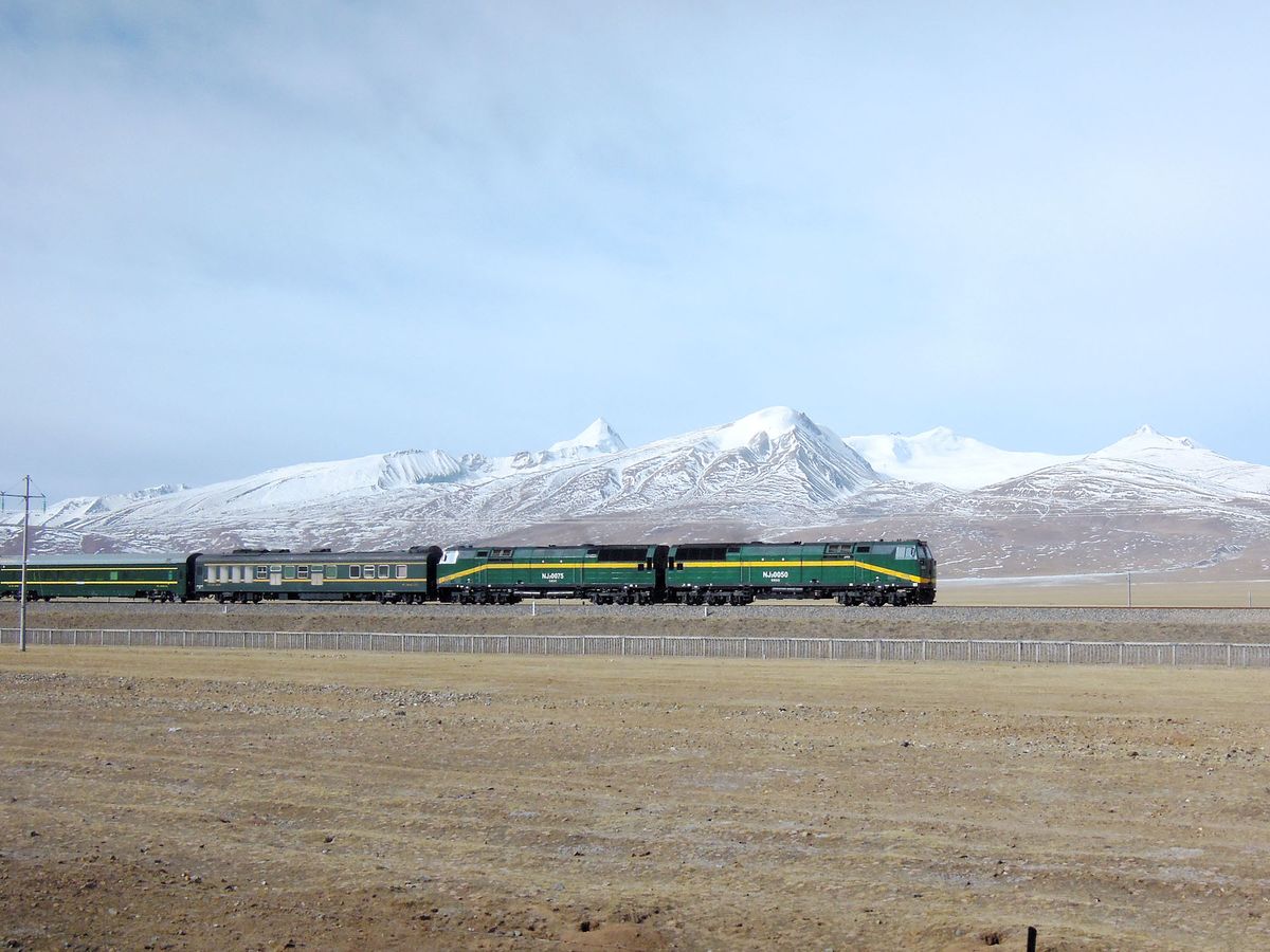 --FILE--A train travels on the Qingzang (Qinghai-Tibet) Railway in southwest Chinas Tibet Autonomous Region, 27 February 2014.China plans to extend a railway line linking Tibet with the rest of the country to the borders of India, Nepal and Bhutan by 2020 once an extension to a key site in Tibetan Buddhism opens, a state-run newspaper reported on Thursday (24 July 2014). China opened the railway to Lhasa, the capital city of Tibet, in 2006, which passes spectacular icy peaks on the Tibetan highlands, touching altitudes as high as 5,000 metres above sea level, as part of government efforts to boost development. The Global Times, published by the Peoples Daily, said that an extension to Shigatse, the traditional seat of Tibetan Buddhisms second-highest figure, the Panchen Lama, would formally open next month. That link is scheduled for its own extension during the 2016-2020 period to two separate points, one on the border of Nepal and the other on the border with India and Bhutan, the newspaper cited Yang Yulin, deputy head of Tibets railways, as saying, without providing details. (Photo by Chen hao / Imaginechina / Imaginechina via AFP)