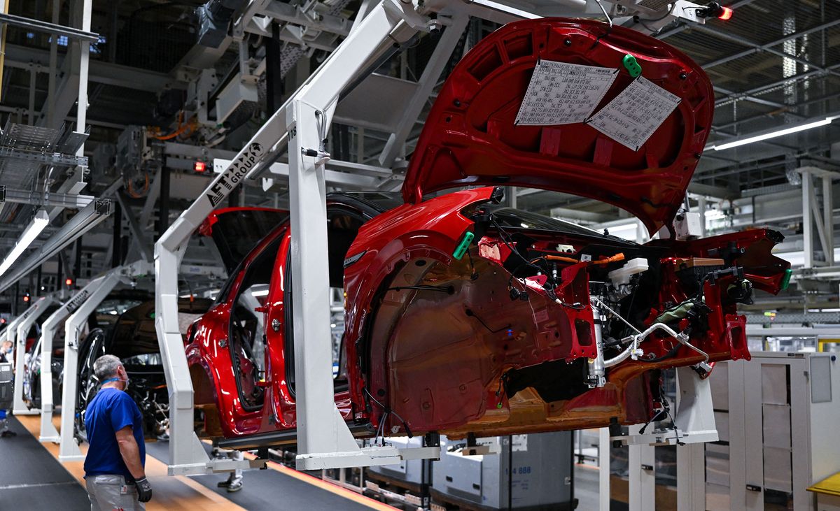27 January 2022, Saxony, Zwickau: An ID.5 rolls down the line at Volkswagen's plant in Zwickau. At the turn of the year, production of the new ID.5 model began at the Saxon plant; it is the sixth pure electric vehicle to be manufactured here. Like the other models, the vehicle is based on the Modular Electric Toolkit. Volkswagen has converted the site, which employs around 9,000 people, into a purely electric vehicle factory at a cost of ∑1.2 billion and has now completed the transformation to an e-site. Photo: Hendrik Schmidt/dpa (Photo by HENDRIK SCHMIDT / DPA / dpa Picture-Alliance via AFP)