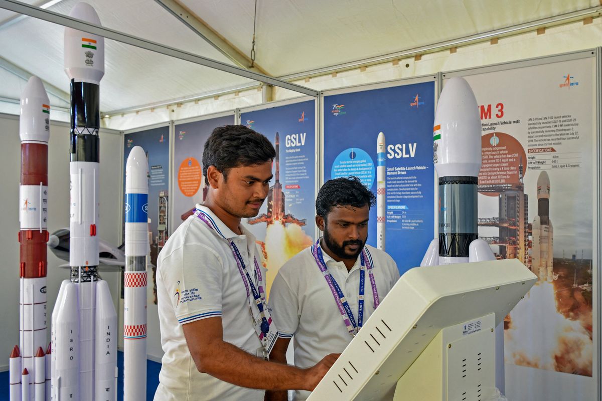Visitors browse through a kiosk to know about indigenously developed various satellite launch vehicles designed and developed by Indian Space Research Organisation (ISRO) at the Human Space Flight Expo organised by the ISRO at the Jawaharlal Nehru Planetarium in Bangalore on July 21, 2022. 