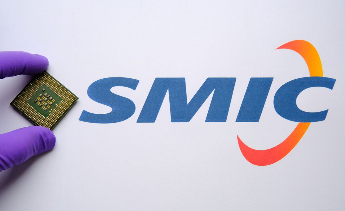 Smic,Logo,On,The,Document,And,Hand,In,Glove,Placing