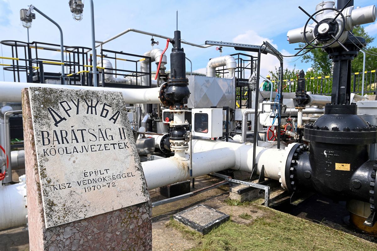 A photo taken on May 5, 2022 shows the receiver station of the Druzhba pipeline of petroleum between Hungary and Russia with a memorial plate of its construction at the Duna (Danube) Refinery of Hungarian MOL Company located near the town of Szazhalombatta, about 30 km south of Budapest. - Europe faces the prospect of a diesel supply shortage following sanctions on Russia. MOL's Duna Refinery continues to receive Russian crude through the Druzhba pipeline. (Photo by ATTILA KISBENEDEK / AFP)