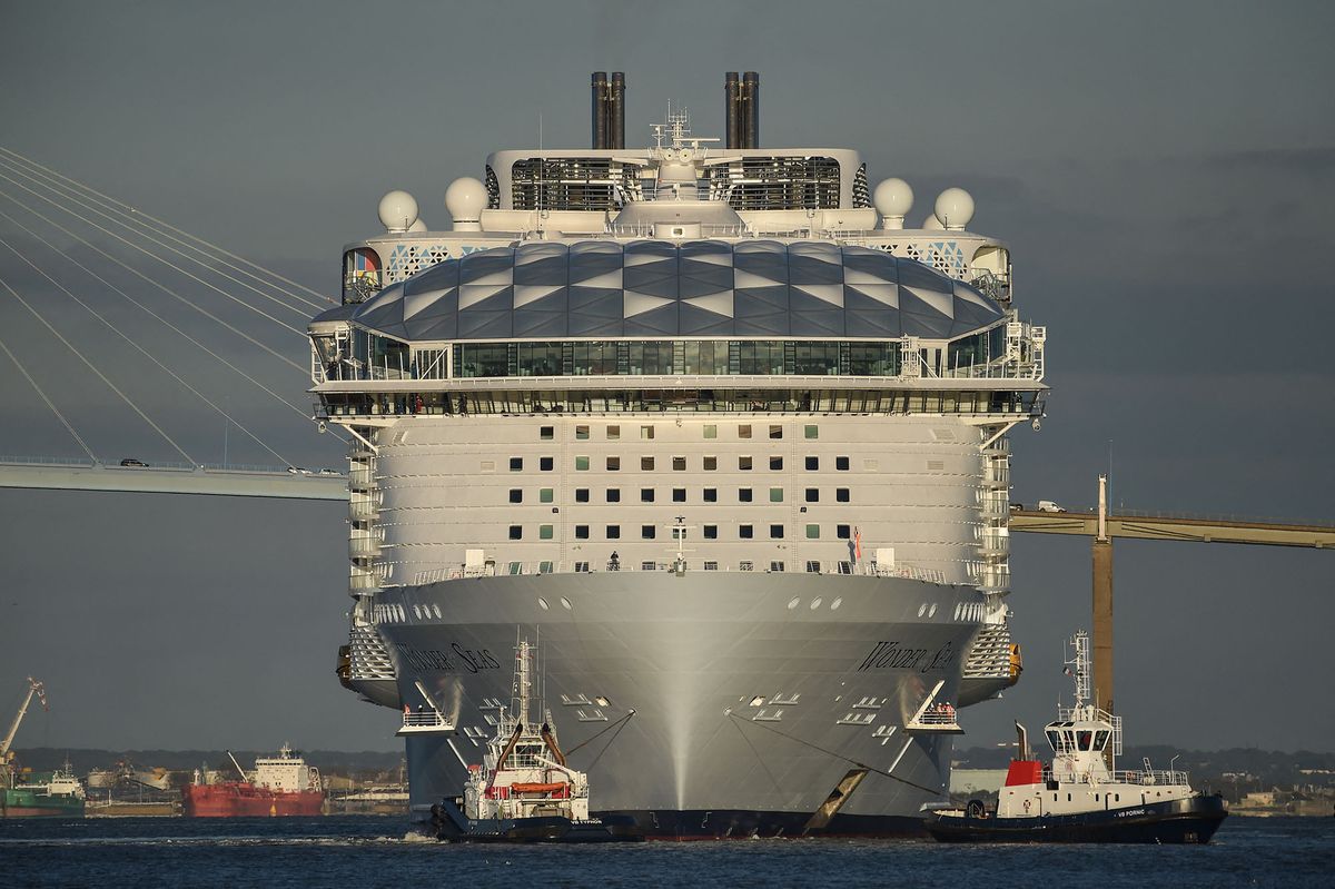 This photograph taken on November 5, 2021 shows American operator Royal Caribbean Cruise ship (RCCL) new cruise ship "Wonder of the seas" leaving the "Chantiers de l'Atlantique" shipyard in Saint-Nazaire, western France, heading for Marseille's harbour. (Photo by Sebastien SALOM-GOMIS / AFP)