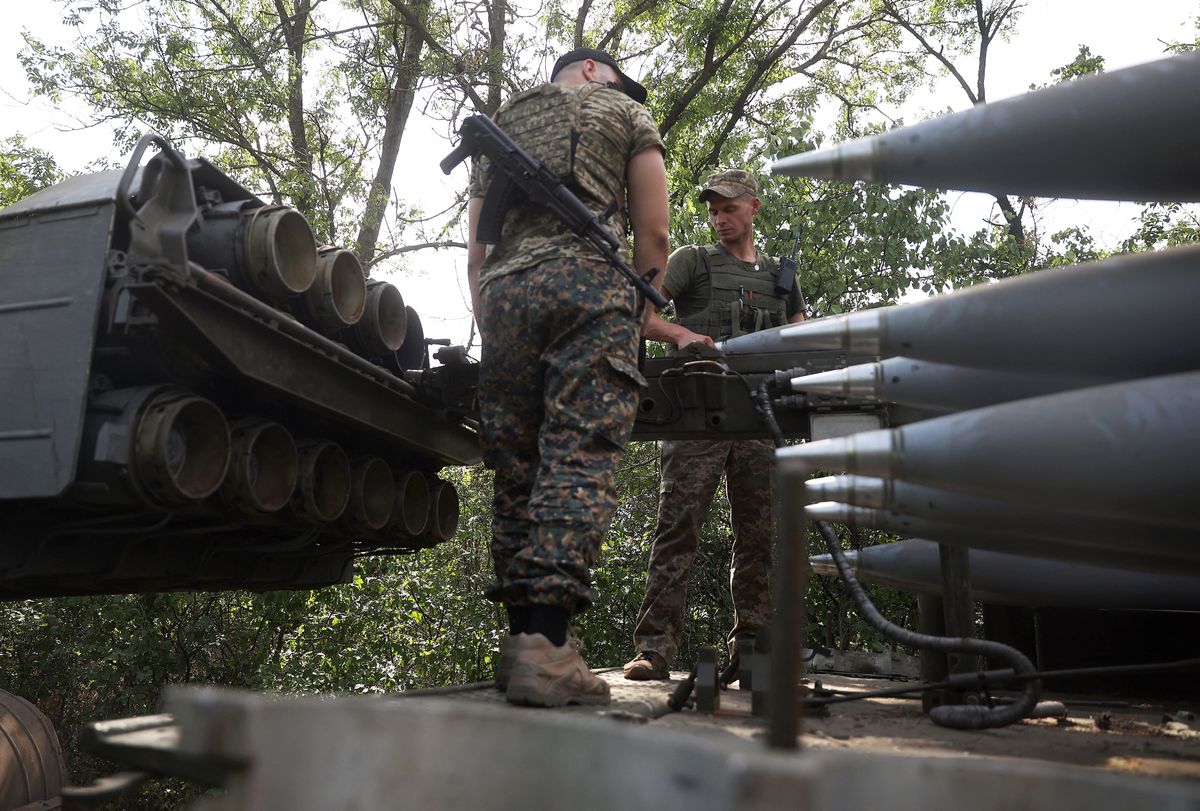 Ukrainian gunners prepare to fire with a BM-27 Uragan, a self-propelled 220 mm multiple rocket launcher, at a position near a frontline in Donetsk region on August 27, 2022, amid the Russian invasion of Ukraine. (Photo by Anatolii Stepanov / AFP)