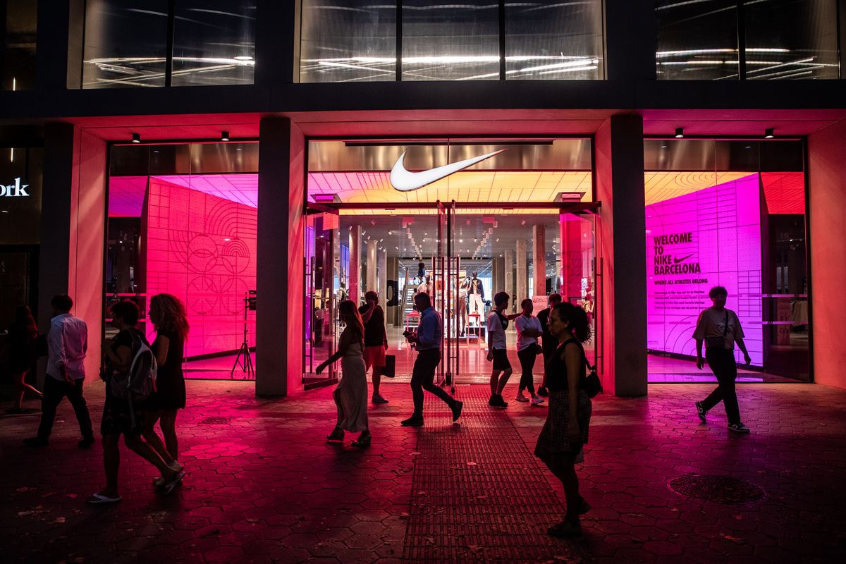 An illuminated Nike Inc. store, ahead of the start of new rules requiring businesses to turn off lighting at night, in Barcelona, Spain, on Wednesday, Aug. 10, 2022. Spains government has pushed to save energy with new rules which include extinguishing illuminations after 10 p.m. and preventing air conditioning being turned down too low in summer or the heating up too high in winter. 