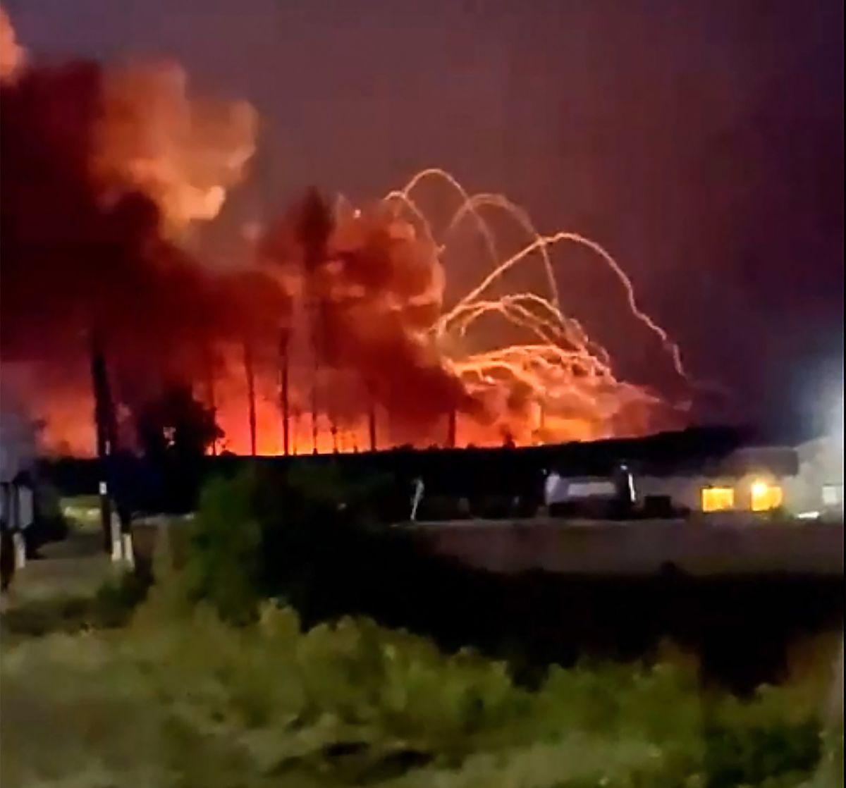 This still frame from a video courtesy by @steelmalikov taken on August 18, 2022 shows fire and smoke billowing from munitions depot near the village of Timonovo outside Belgorod, on August 18, 2022. - Two Russian villages were evacuated on August 18, 2022 after a fire broke out at an ammunition depot near the border with Ukraine, local authorities said. CREDIT "AFP PHOTO /Telegram/ @steelmalikov " - NO MARKETING - NO ADVERTISING CAMPAIGNS - DISTRIBUTED AS A SERVICE TO CLIENTS - NO ARCHIVES