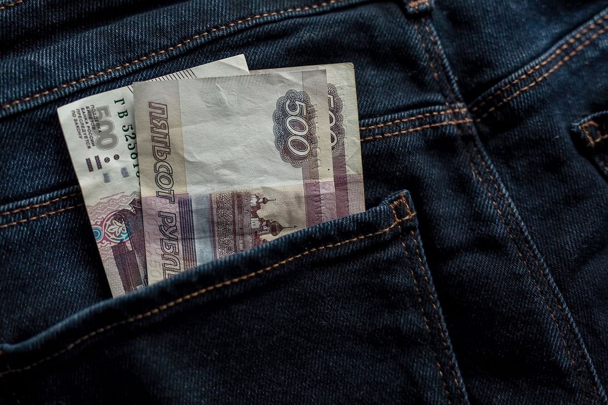 money in your pocket. Russian rubles. bills of 500 rubles in a trouser pocket. jeans pants, money in my pocket. business, trade or financial transactions, fraud, corruption and bribery. close