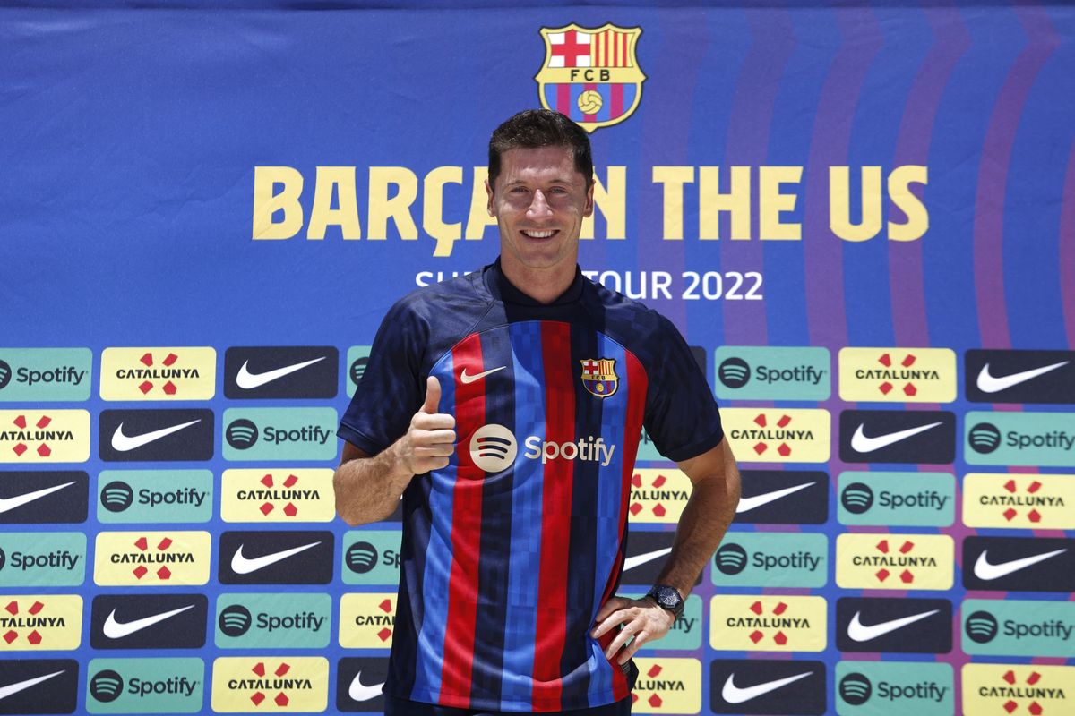 Polish football player Robert Lewandowski, gives a thumbs up during a press conference in Fort Lauderdale, Florida, on July 20, 2022, as he is introduced as club Barcelona newest player. Lewandowski will bring the 'winning mentality' Barcelona need according to new teammate Andreas Christensen. The Polish superstar has arrived in Miami to complete his move to the La Liga giants from Bayern Munich ahead of a July 20, friendly with David Beckham's Inter Miami.
Marco BELLO / AFP