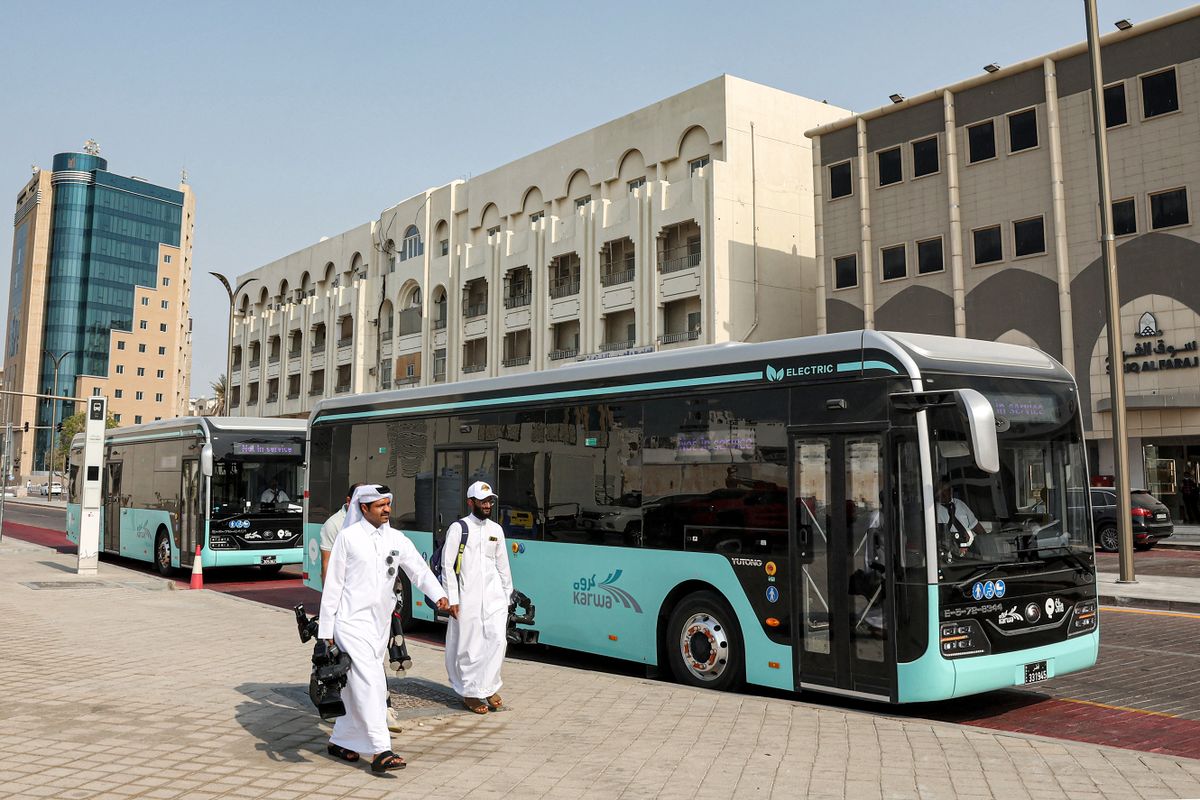 This picture taken on August 18, 2022 shows a view of some of the 1300 buses operated by Mowasalat Qatar -- the official land transport provider in the gulf emirate -- during a test run in Doha amidst preparations ahead of the Qatar 2022 FIFA World Cup. (Photo by KARIM JAAFAR / AFP)