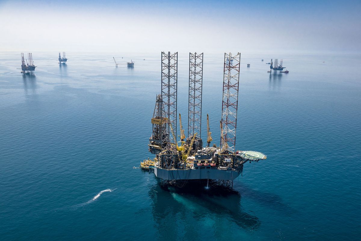 A handout picture provided by Energy giant Saudi Aramco, Saudi Arabia's state-owned oil and gas company, shows its rigs in HSBH field north of Dhahran in the eastern province of Saudi Arabia on March 20, 2018. - Aramco posted on May 12, 2020 a 25 percent slump in first-quarter profit and said the coronavirus crisis which triggered a crash in oil prices would weigh heavily on demand in the year ahead. (Photo by Mohamed ALEBN ALSHAIKH / Saudi Aramco / AFP)