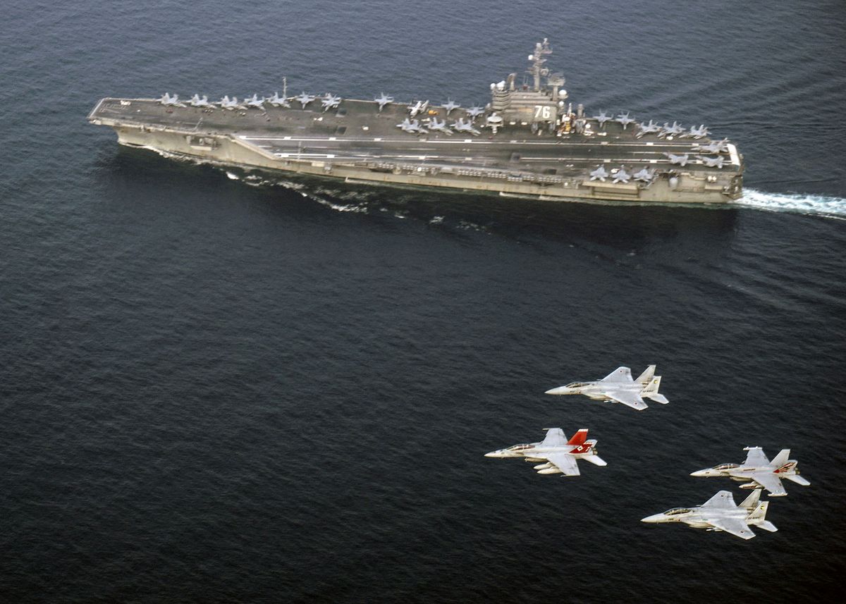 This US Navy photo obtained June 2, 2017 shows US Navy and Japan Air Self-Defense Force aircraft as they fly in formation over the Nimitz-class aircraft carrier USS Ronald Reagan (CVN 76)on June 1, 2017 in the Sea of Japan. - The US Navy and Japan Air Self-Defense Force routinely fly together to continue efforts of supporting security and stability in the Indo-Asia-Pacific region. (Photo by Artur SEDRAKYAR / US NAVY / AFP)