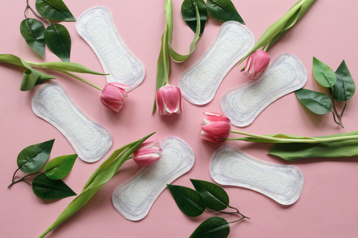 Sanitary Pads And Pink Tulips On Pink Background