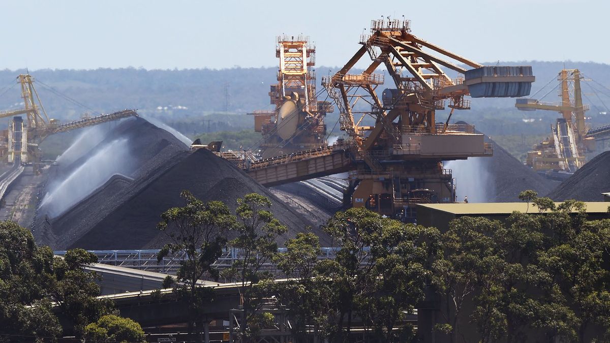 To go with Climate-warming-UN-COP21-Australia-coal,FEATURE by Madeleine CooreyA photo taken on November 18, 2015, shows some of the coal operations at the Port of Newcastle as Australia plans to dramatically ramp up coal exports -- which is the nation's second most valuable export -- to boost economic growth over the next decade despite climate change activists arguing new planned mines are "carbon bombs" incompatible with limiting temperature rises.  As the world meets for climate change at talks in Paris, environmentalists say hopes of curbing global warming to less than two degrees Celsius (3.6 Farenheit) are incompatible with Australia's coal expansion plans.  AFP PHOTO / William WEST (Photo by WILLIAM WEST / AFP)