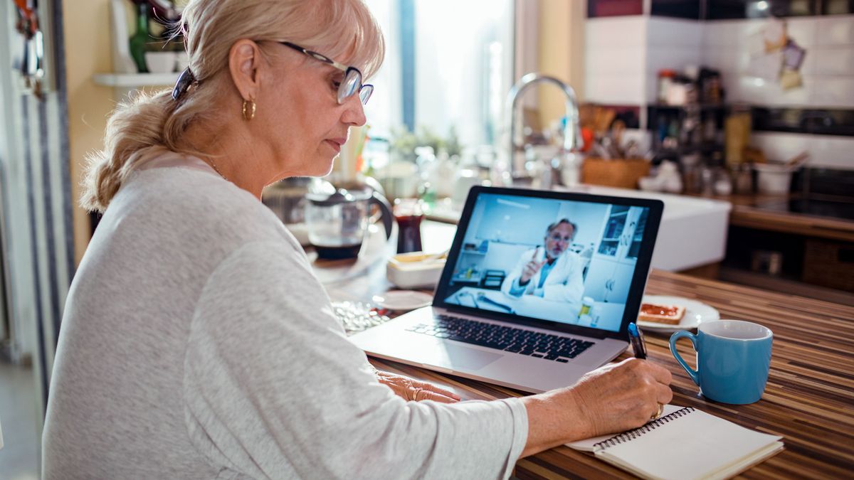 Senior woman consulting with her doctor online