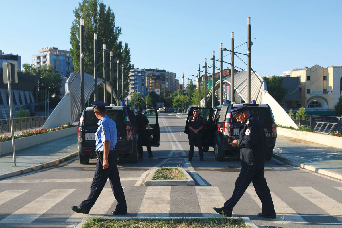 MITROVICA, KOSOVO - AUGUST 01: Members of Kosovo Force (KFOR) take measures at a checkpoint after Kosovo decided to postpone the implementation of a new law set to come into effect Monday making it mandatory for everyone, including Serbs living in Kosovo, to have a Kosovo ID card and license plate in Mitrovica, Kosovo on August 01, 2022. Erkin Keci / Anadolu Agency (Photo by Erkin Keci / ANADOLU AGENCY / Anadolu Agency via AFP)