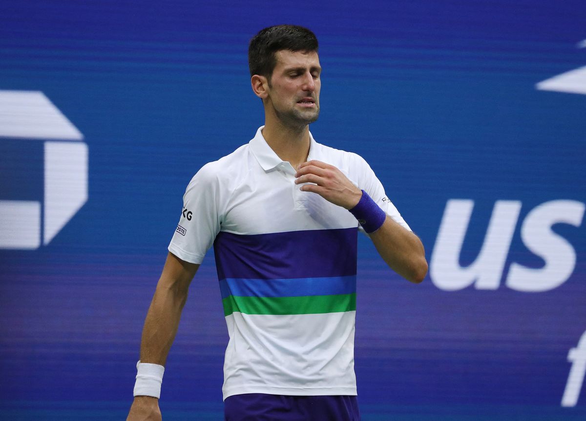  In this file photograph taken on September 13, 2021, Serbia's Novak Djokovic reacts after defeat against Russia's Daniil Medvedev after their 2021 US Open Tennis tournament men's final match at the USTA Billie Jean King National Tennis Center in New York. - Novak Djokovic announced on August 25, 2022, shortly before the draw, that he would not be able to take part in the US Open, which starts on August 29, because he cannot travel to the United States because he has not been vaccinated against Covid-19. (Photo by Kena Betancur / AFP)