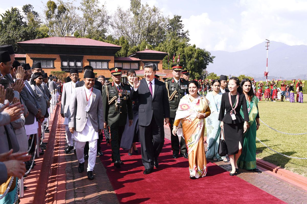 (191013) -- KATHMANDU, Oct. 13, 2019 (Xinhua) -- Nepali President Bidya Devi Bhandari hosts a grand farewell ceremony for Chinese President Xi Jinping at the airport in Kathmandu, Nepal, Oct. 13, 2019. Nepali Vice President Nanda Bahadur Pun, Prime Minister K.P. Sharma Oli, Chairman of the National Assembly Ganesh Prasad Timilsina, cabinet members and senior army generals also attended the ceremony. Chinese President Xi Jinping returned to Beijing from Kathmandu on Sunday. (Xinhua/Gao Jie) (Photo by Gao Jie / XINHUA / Xinhua via AFP)