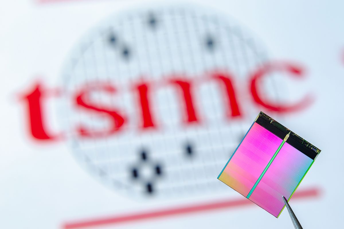 London,/,United,Kingdom,-,June,12,2019:,Close,Up, London / United Kingdom - June 12 2019: Close up photo of microchip (aka semiconductor chip, semiconductor device, Integrated Circuit) hold in tweezers with TSMC logo on a background.