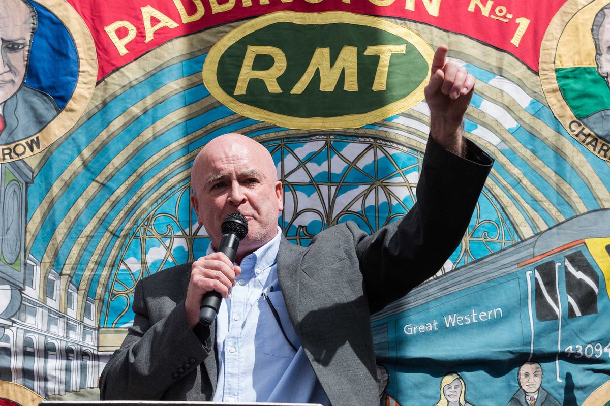 LONDON, UNITED KINGDOM - JUNE 25: General Secretary of the National Union of Rail, Maritime and Transport Workers (RMT) Mick Lynch speaks during a rally in solidarity with striking railway workers outside King's Cross Station on the third day of the biggest national rail strike in Britain in 30 years in London, United Kingdom on June 25, 2022. Train journeys across Britain are reduced to 20% of the regular timetable for the third time this week as 40,000 workers from 13 train operating companies and Network Rail walk-out in a dispute over pay, jobs and conditions after talks to avert the strike action have failed to reach an agreement. 